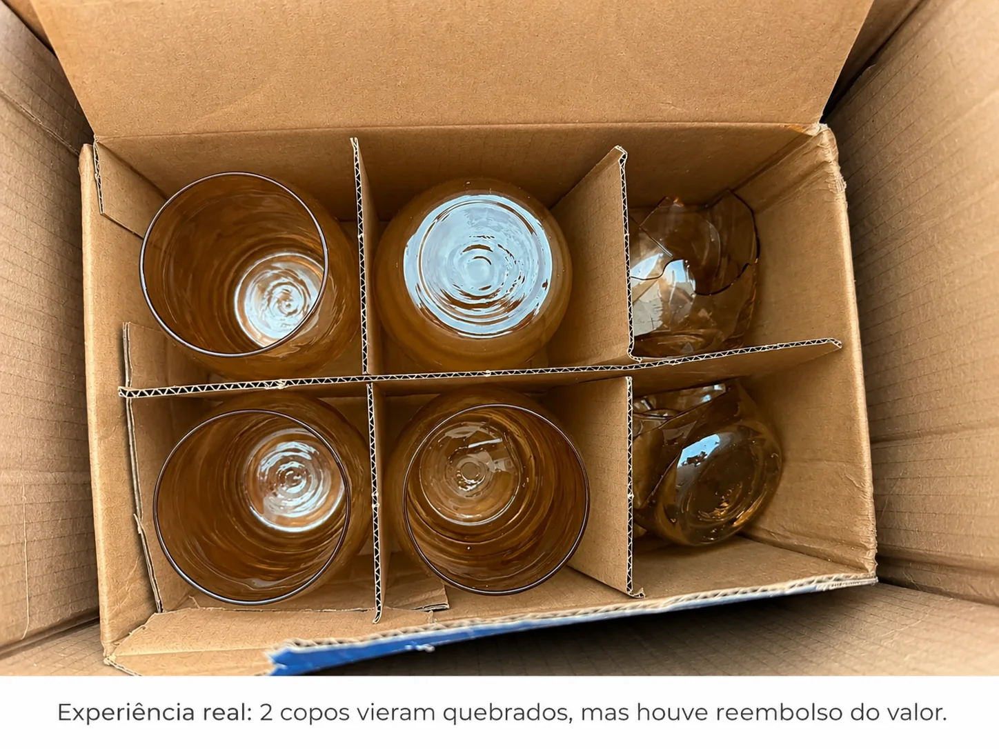 Jogo de copos de vidro comprado na Shopee com dois copos quebrados dentro da caixa